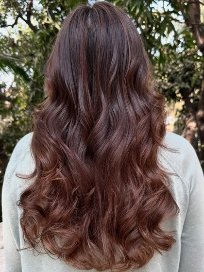 This is my 'Chocolate Pecan Dream' creation. We started with a faded base and gave her this incredibly rich, warm brown with delicate pecan highlights. The result is a glossy, healthy-looking color that’s perfect for any season.