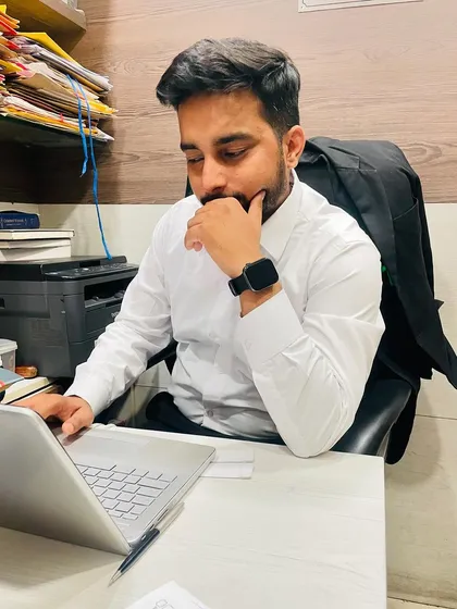 Chasing excellence means paying attention to every detail. Here I am at my desk, focused on case preparation. A successful outcome is built on a foundation of thorough and diligent work.