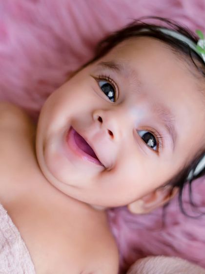 The smile that makes my job the best in the world. This close-up of a smiling newborn is a perfect example of the magic I love to capture.