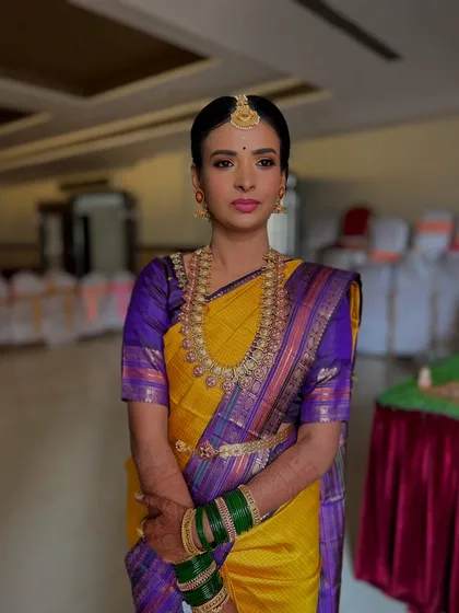 I absolutely adore creating traditional South Indian bridal looks. For this beautiful bride, we chose a classic look with bold eyes, a vibrant lip color to match her stunning Kanjivaram saree, and a flawless base that lasted through the entire ceremony.