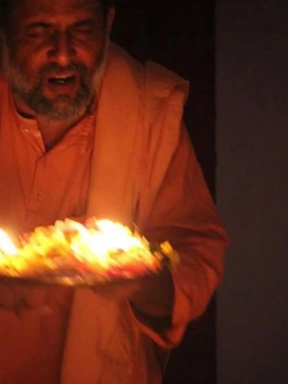 Performing Arati, the waving of light, during a satsang in Montreal. This ritual is a beautiful expression of reverence and gratitude.