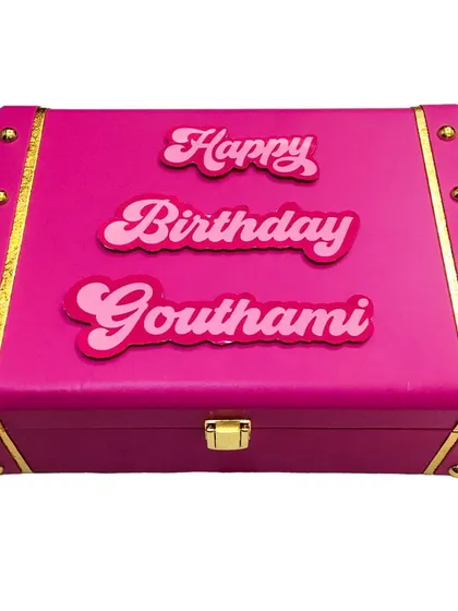 The outside of my custom pink birthday trunk hamper. I personalize it with the recipient's name, making the box itself a beautiful keepsake long after the goodies inside are gone.