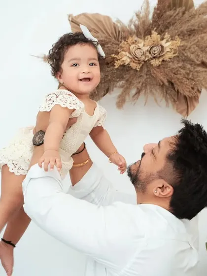 A father's joy lifting his daughter high. These playful, candid shots are full of energy and love, perfect for capturing your child's personality.