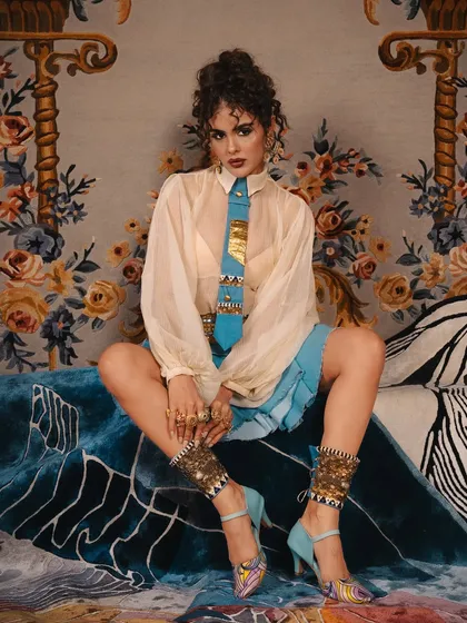 A full-look shot that captures the complete styling, where my makeup and hair work contribute to the overall powerful aesthetic.