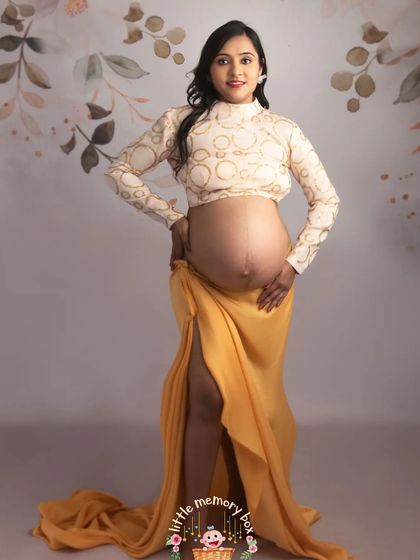 Here is the same beautiful outfit against a soft, floral backdrop. Changing the background can completely change the mood of the photo, giving you more variety in your gallery.