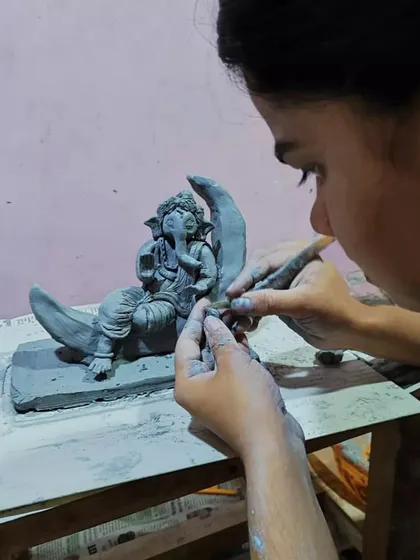 Here you can see the delicate process of sculpting. I use fine tools to add details to the dhoti and ornaments on this 'Bappa on the Moon' idol. Every part is shaped by hand, with no molds involved.
