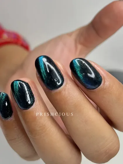 If you love black nails, you have to try a black cat eye. This design on gel overlays has a deep green and blue shift that is absolutely mesmerizing.