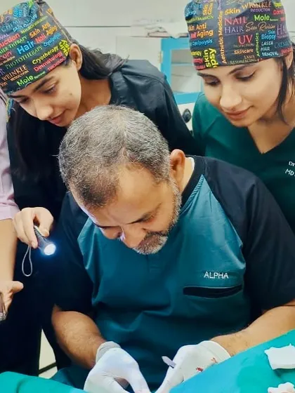 Learning from a master. Observing surgical techniques up close during my fellowship allows me to refine my own skills and stay at the forefront of dermatological surgery.
