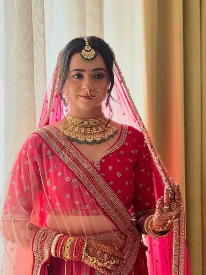 My bride Neha, looking elegant and serene as she holds her dupatta, ready for her wedding ceremony.