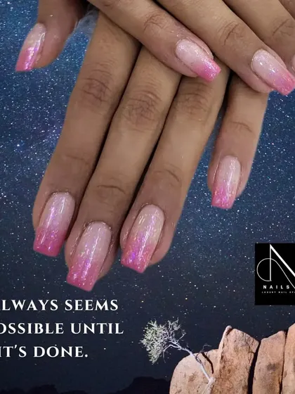 "It always seems impossible until it's done." We can make your dream nails, like this sparkling pink ombre, a reality.