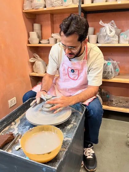 Finding his flow at the wheel. The rhythmic spinning and gentle pressure are a form of active meditation that helps melt away the day's worries.