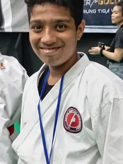 Another one of our students with his medal at a competition. We train them to be humble in victory and gracious in defeat.