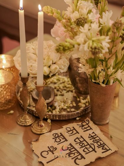 A personal touch with a hand-written Hindi love quote on burnt-edge paper, adding a rustic and heartfelt element to the decor.