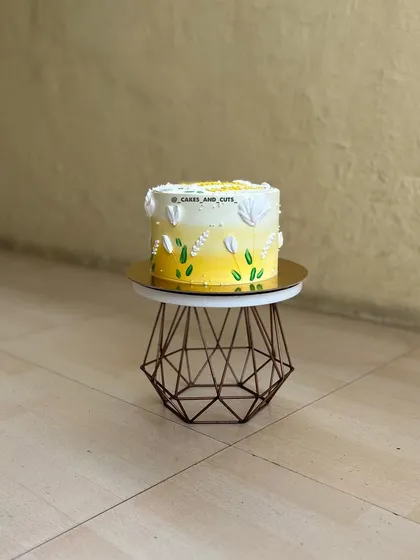 A full view of the yellow ombre floral cake, a bright and cheerful choice for any celebration.