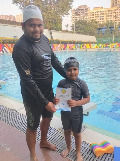 Another successful student from our BKC branch proudly holds his certificate after being promoted to the next training level.