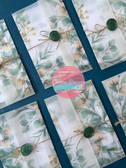 Our "Save The Date" cards are designed to be as unique as your love story. These beautiful floral cards come in a translucent envelope sealed with a custom wax stamp.