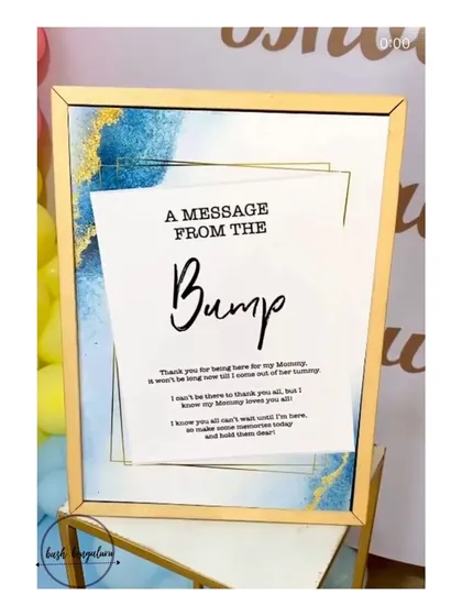A close up of one of my favorite personal touches, a 'Message from the Bump' sign. These small details help make your baby shower uniquely yours.