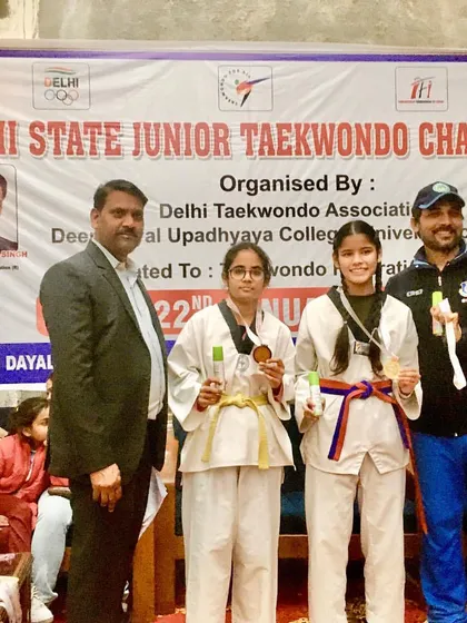 Celebrating victory at the Delhi State Junior Taekwondo Championship. I am proud to stand with my gold medalists, Khushi and Priya, who both earned their spot in the National Championship.