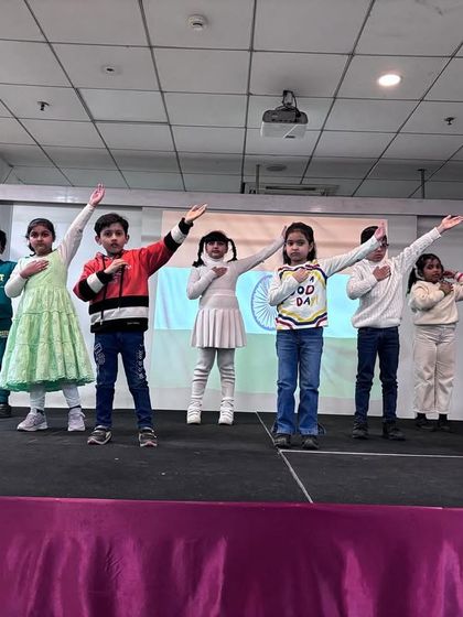 The students strike a patriotic pose, saluting the nation at the conclusion of their powerful Republic Day performance.