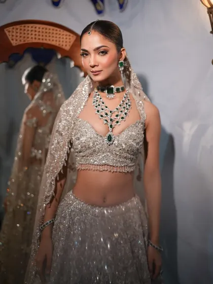 Modern luxury meets timeless elegance. This silver sequined lehenga is paired with a statement emerald and diamond necklace, a combination I styled to create a glamorous and sophisticated look for a grand evening event.