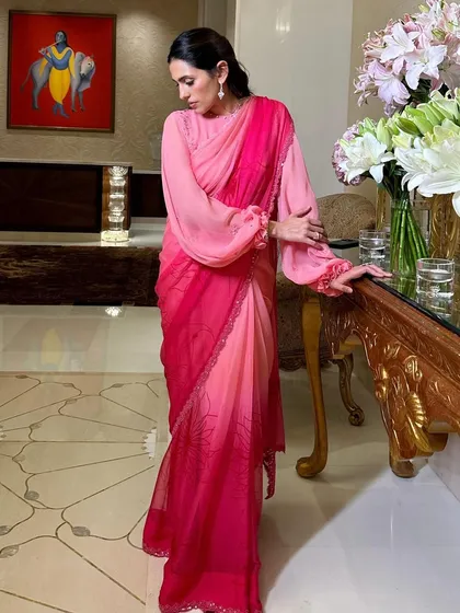 This ombre pink saree by Manish Malhotra is modern, romantic, and so chic. The full-sleeve blouse and delicate lace border add a contemporary touch.