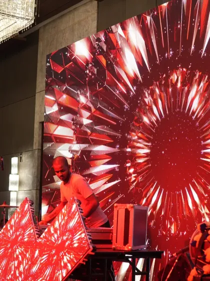 Our team setting up the 3D LED wall for a Sangeet night, an example of the cutting edge technology we use for event production.