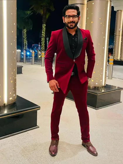 Ready for the reception. A confident host in a great outfit sets the tone for a fantastic evening.