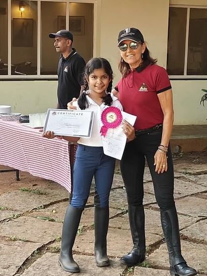 Another happy camper receives her certificate, marking the successful completion of the EIRS Summer Camp. We love celebrating the progress of each and every child.