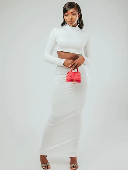 A final full-length shot from the series, with a confident and direct pose.