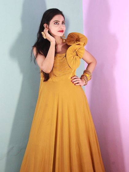 Our model looking chic in the yellow Haldi gown, a great alternative to a traditional lehenga.