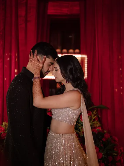 An intimate moment from a glamorous Sangeet night. Against a backdrop of rich red velvet, I designed a space that felt both cinematic and deeply personal, allowing for quiet moments of connection amidst the celebration.