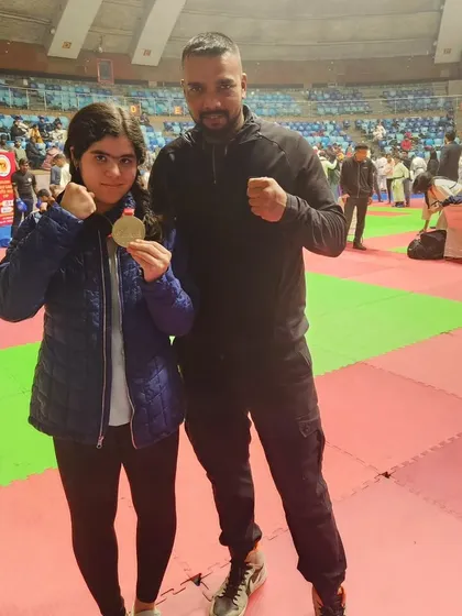 Another young female fighter from my team with her well-earned medal. Her hard work and courage are an inspiration.