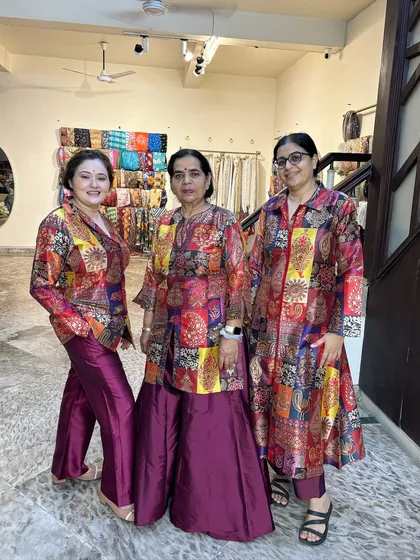 Our three beautiful clients in their matching-but-different outfits. We love creating coordinated looks for groups.