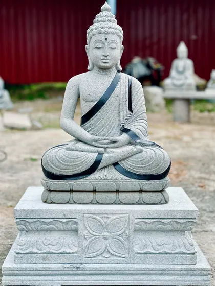 I also supply decorative stone sculptures to add a touch of peace to your garden. This is a handcrafted stone Buddha statue, complete with a detailed pedestal, ready to become a garden's centerpiece.