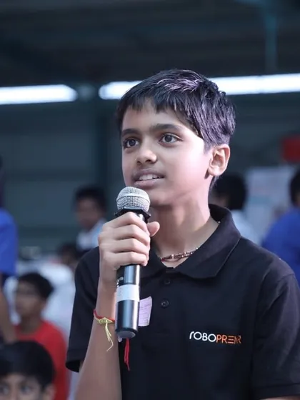 A student confidently takes the microphone at our RW2024 event. We nurture this curiosity, guiding students to ask insightful questions and explore how technology can be used to solve challenges, turning them from tech users into tech creators.