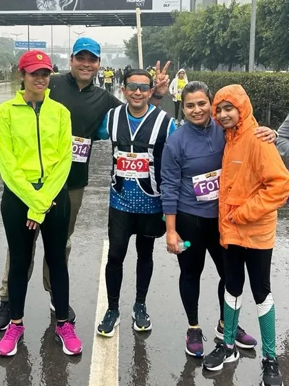 A group photo from a rainy race day. A little rain can't stop us.