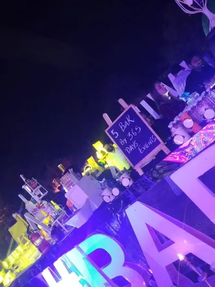 A wide-angle view of the bustling LED bar at night. This perspective shows how the bright, colorful lighting makes the bar a central attraction, drawing guests in and energizing the party atmosphere.
