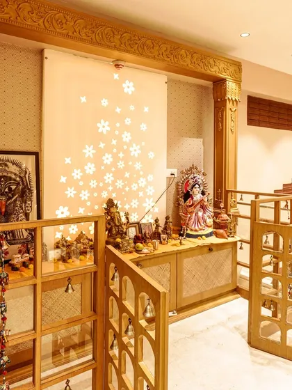 A spiritual corner should feel sacred and personal. I designed this handcrafted wooden pooja unit with intricate details, including bell-adorned folding gates and a backlit Corian panel. It’s a space that blends traditional craftsmanship with modern aesthetics to create a serene oasis within the home.