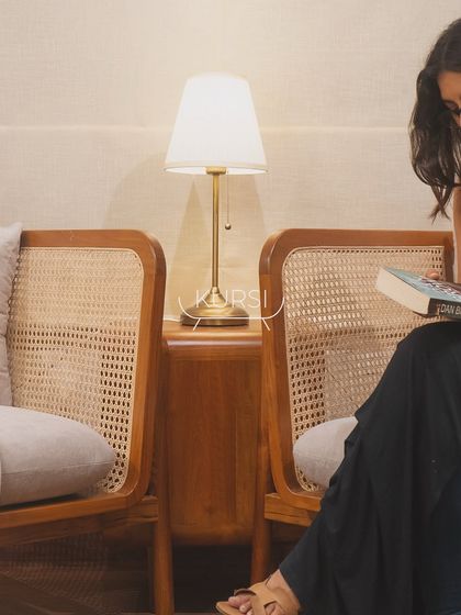 A pair of my teak and rattan armchairs creating a cozy reading corner. The natural materials and simple design bring a sense of calm and timeless elegance to the space.