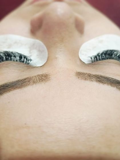 A great example of how our lash extensions can complement perfectly shaped brows. This client has both our lash extensions and healed microblading for a complete, polished look.