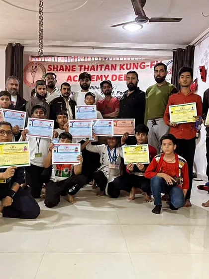 We are a team. A family of fighters. This is my team at the Shane Thaitan Kung-Fu Academy after a successful belt test. Everyone here earned their rank through sweat and discipline.