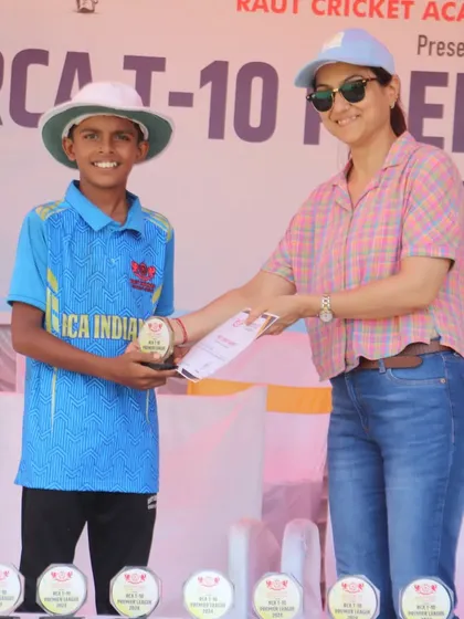 A player from the champion RCA Indians team receiving his award.