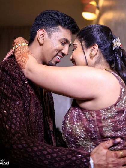 A close-up of a happy embrace, focusing on the couple's joyful expressions.