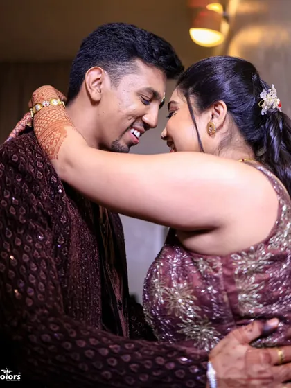A close-up shot of the couple embracing, full of genuine smiles and affection.