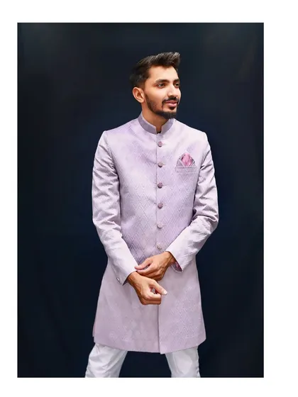 A full-length studio shot of the popular lavender Indo-western outfit. The model's pose shows how the outfit fits and flows, giving you a complete picture of this minimal yet majestic piece.