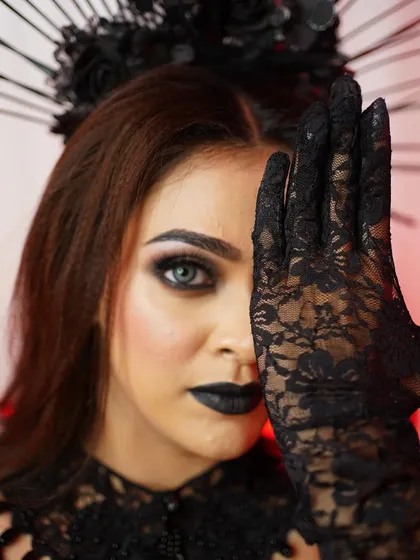 Another take on the dark glamour theme, with a focus on smoky eyes and a mysterious aura.