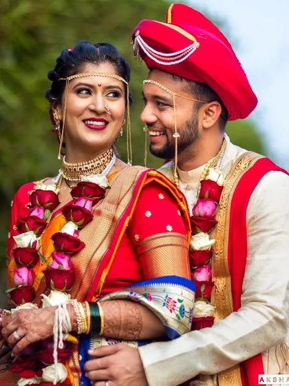 A look of love and admiration. This photo beautifully captures the essence of a traditional Maharashtrian wedding.