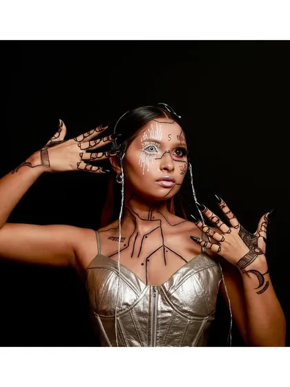 This pose emphasizes the intricate hand and arm makeup, designed to look like robotic circuitry. It shows my attention to detail in extending the artistic concept beyond just the face for a complete avant-garde transformation.
