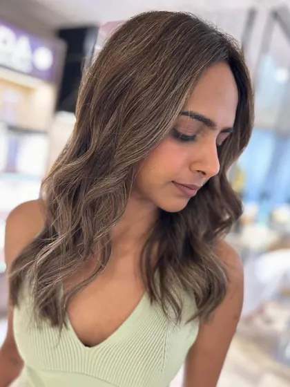 A close-up of the three-tone hair color, showing the seamless blend and how the layers frame her face.
