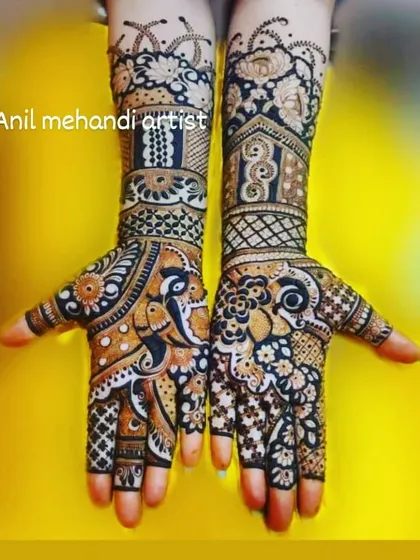 This design is a beautiful example of traditional Rajasthani mehandi. It features intricate peacock figures and detailed filler patterns covering the hands and wrists.